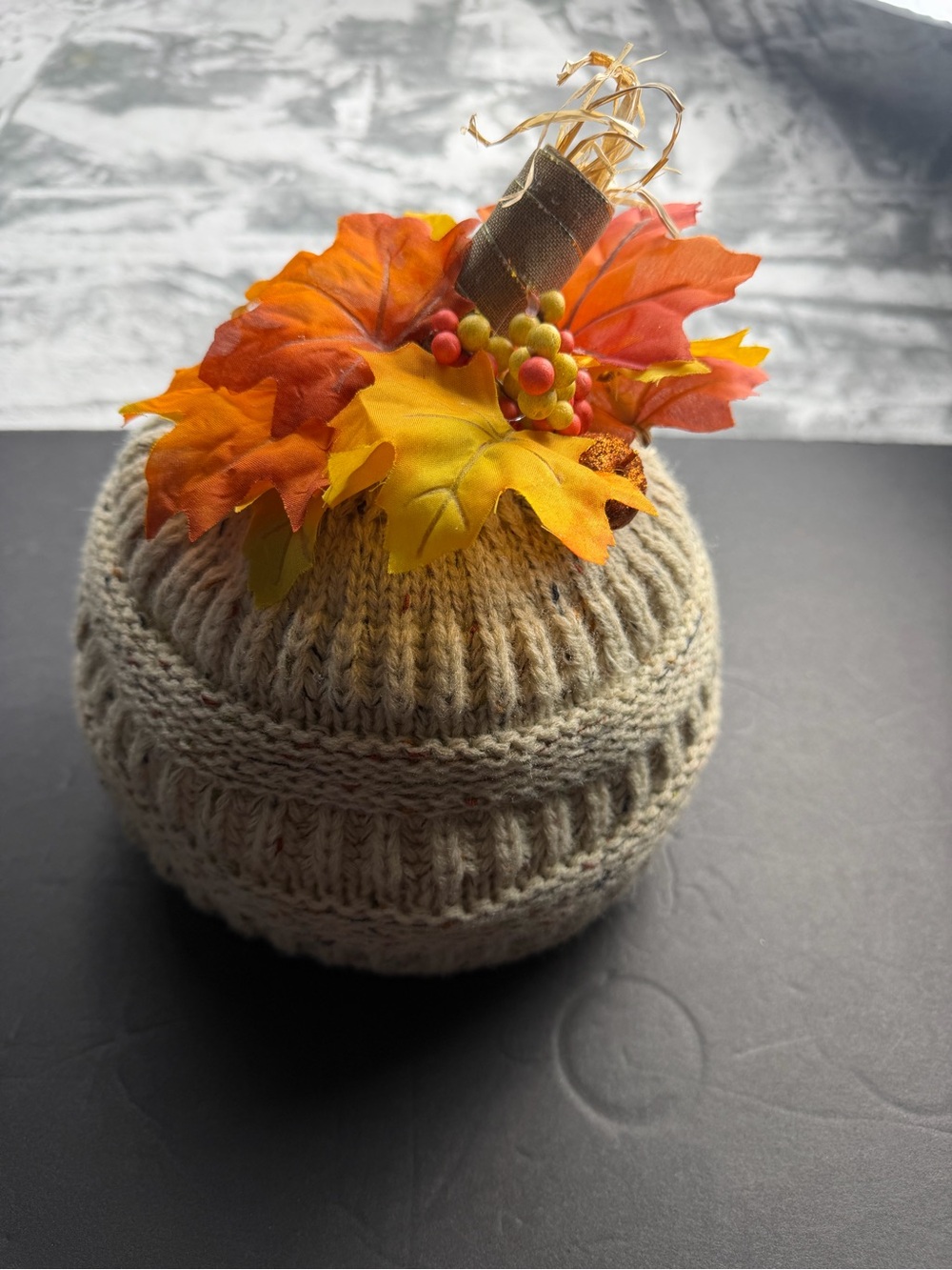Cozy Cream Knit Pumpkin with Autumn Orange & Yellow Leaves